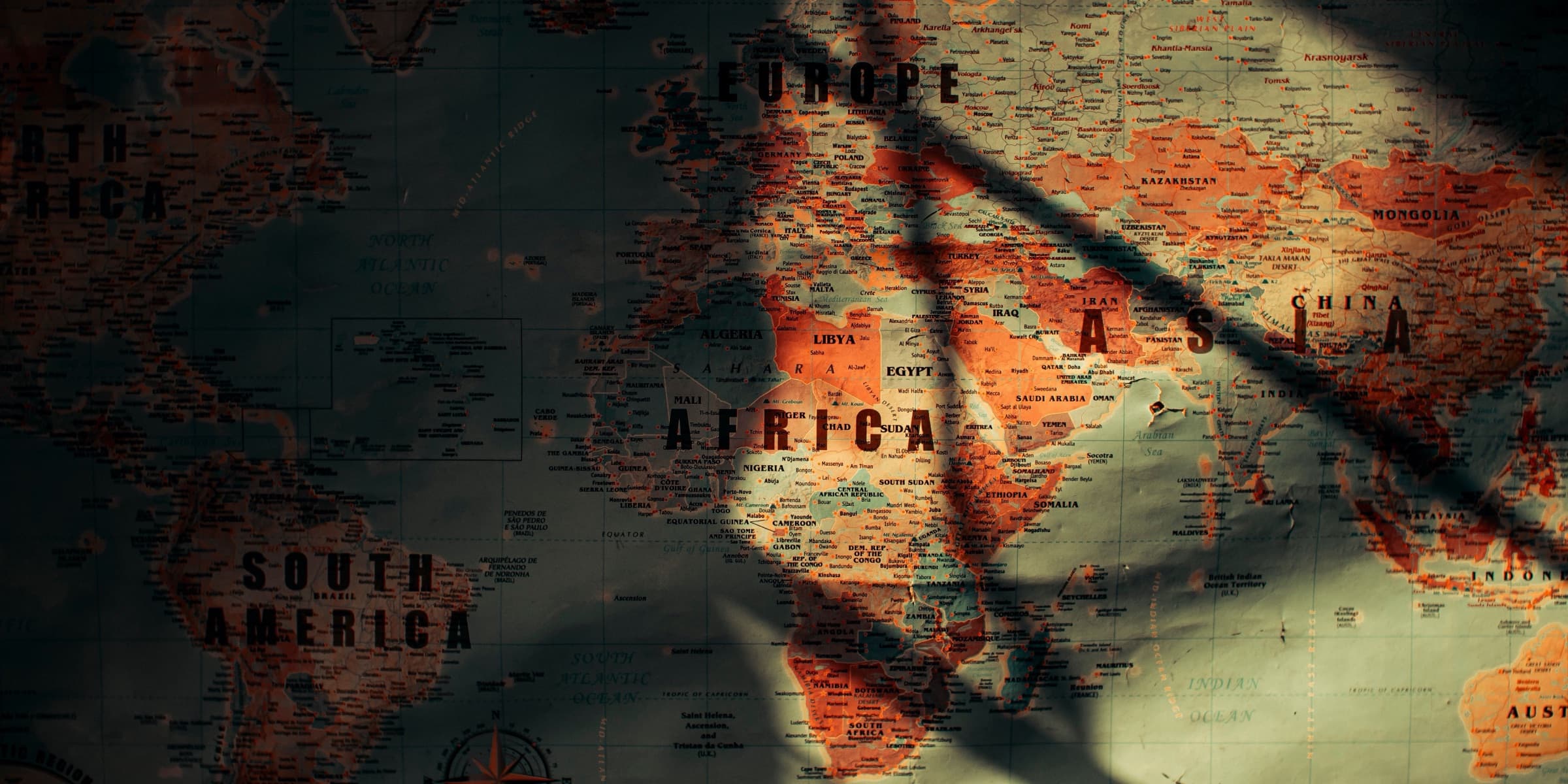 Aged paper world map with continents and oceans