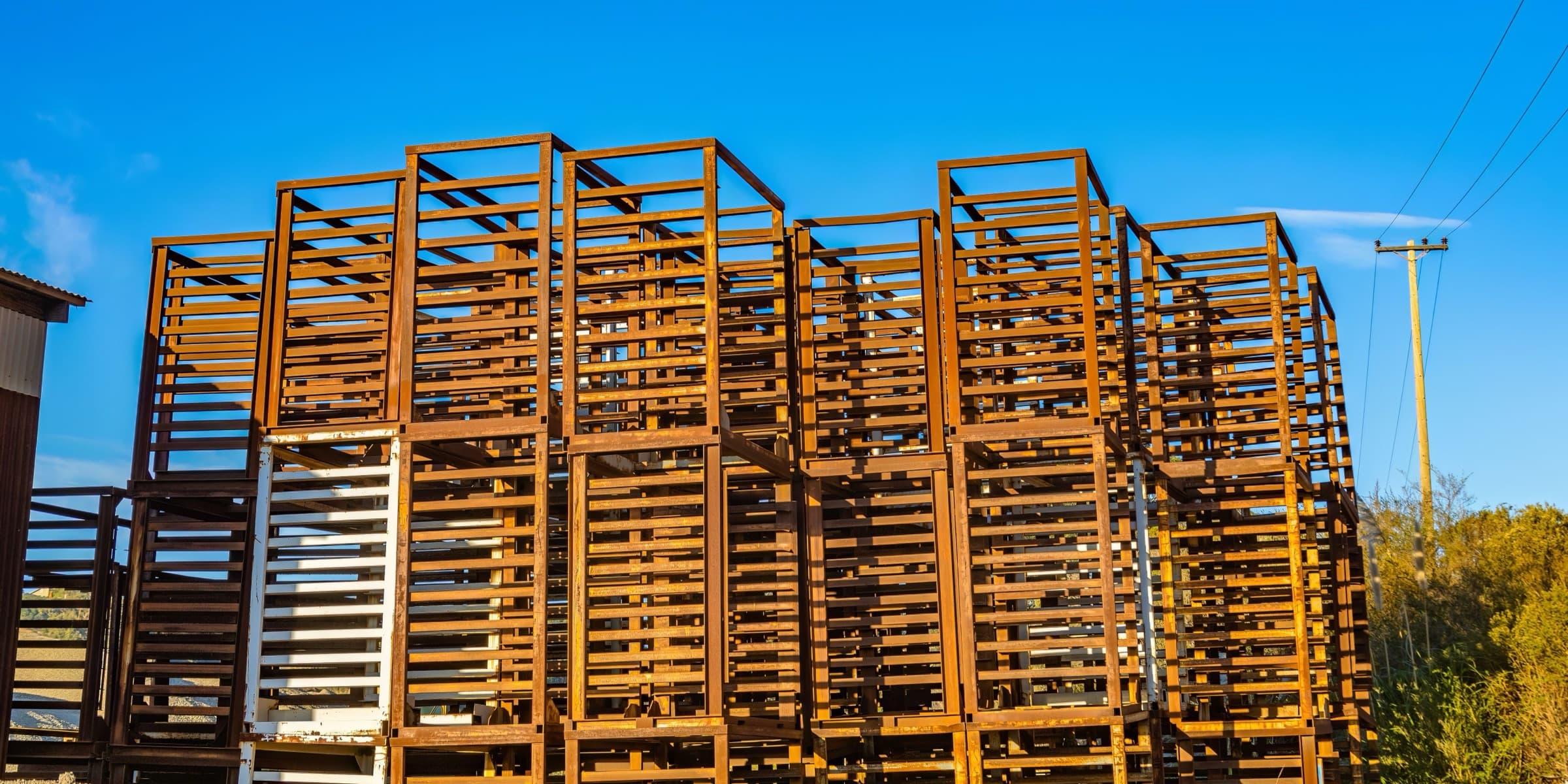 Rusty steel framework against a blue sky